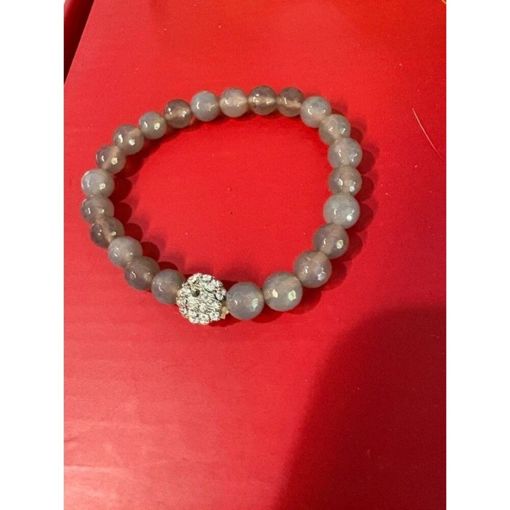 grey faceted stone semi stretch bracelet features a sparkling crystal ball accen